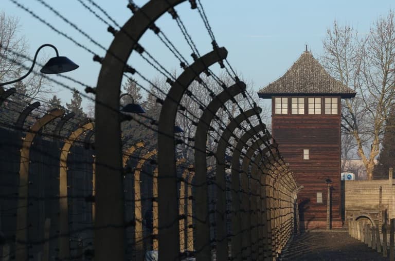 Students make neo-Nazi gesture on trip to Auschwitz and post picture online Students make neo-Nazi gesture on trip to Auschwitz and post picture online